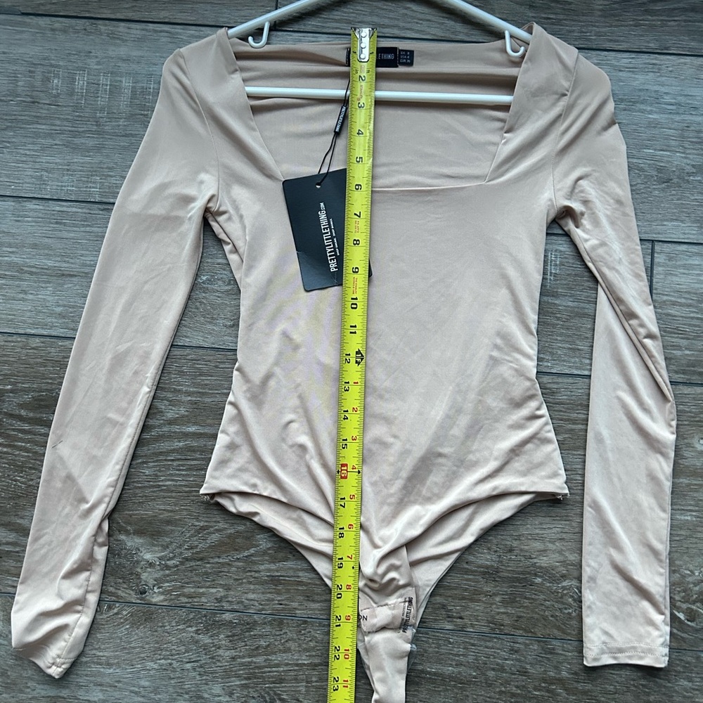 Stone second skin square heck thing bodysuit with snap closure. Flattering fit